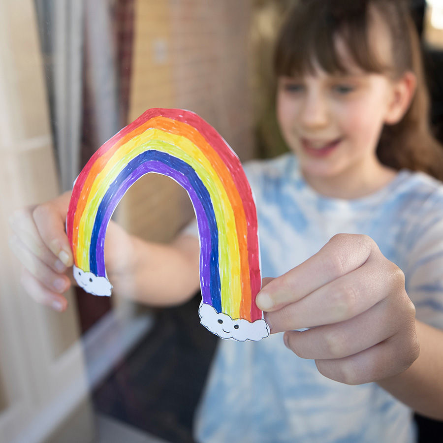 girl holding rainbow